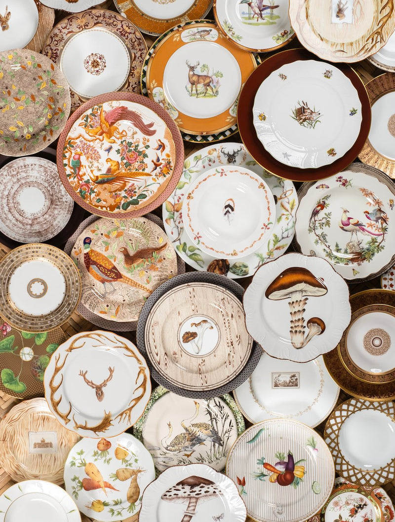 porcelain plates in a variety of different fall hues and assorted motifs